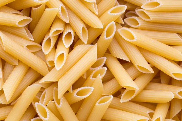 Italienische Makkaroni-Pasta voller Hintergrund. — Stockfoto