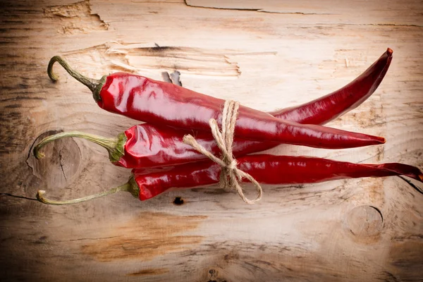 Chili. Red chili peppers on a wooden background. The menu background. — Stock Photo, Image