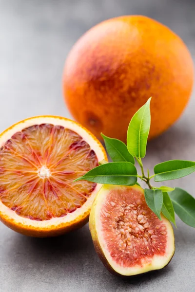 Bloody Sicilian oranges and figs. Shallow depth of field.