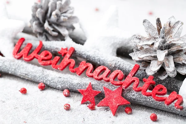 Német Frohe Weihnachten piros betűkkel azt jelenti, hogy boldog karácsonyt. — Stock Fotó
