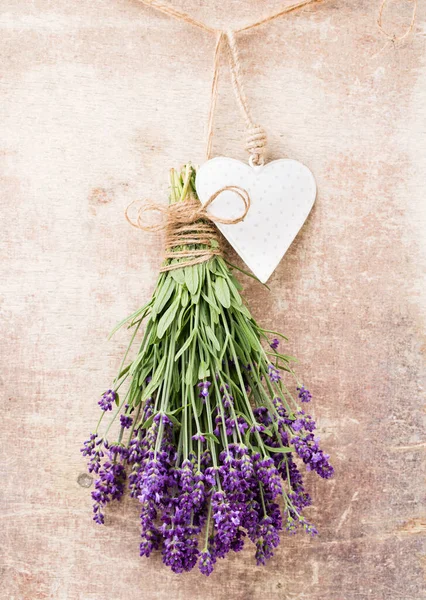 Lavender flowers, bouquet on rustic background, overhead.