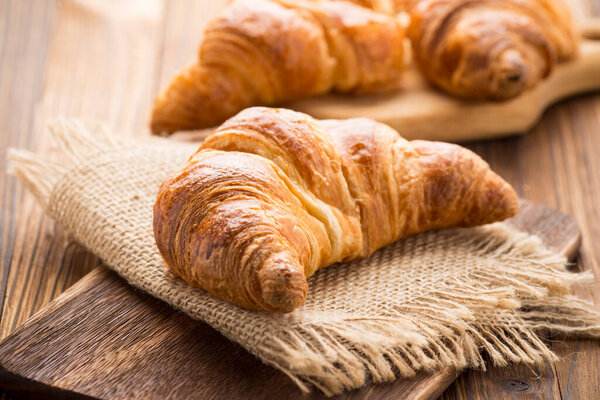 Freshly baked butter croissant. Studio photo.
