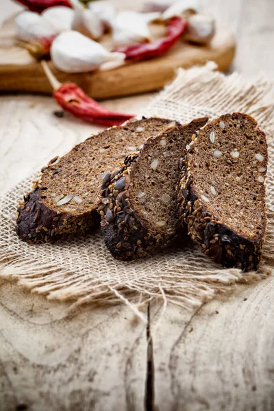 Rye Bread Slice Chilli Pepper Garlic Wooden Background — Stock Photo, Image