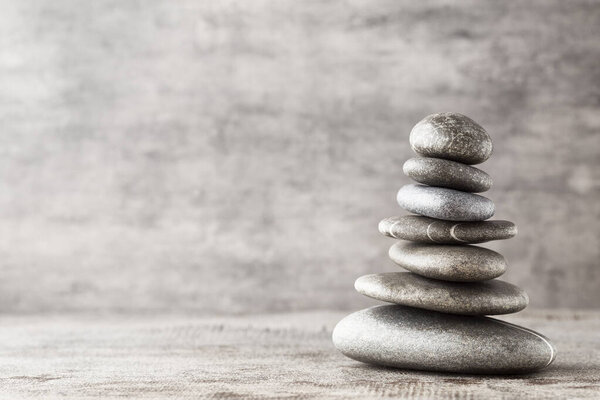 Spa stones on the grey background.