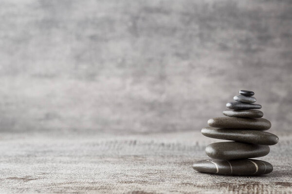 Spa stones on the grey background.