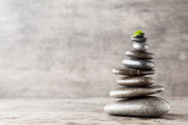 Spa stones on the grey background.