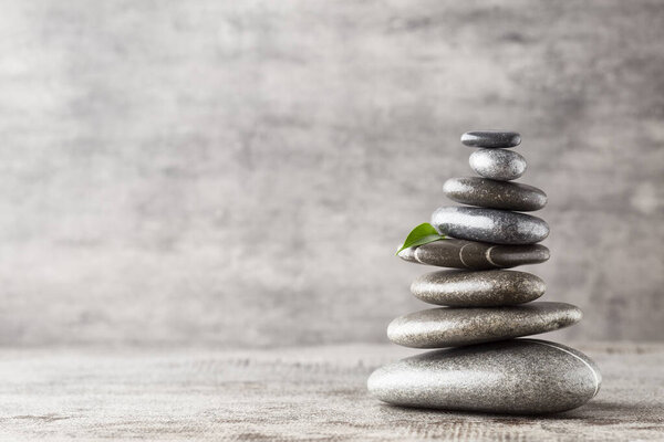 Spa stones on the grey background.
