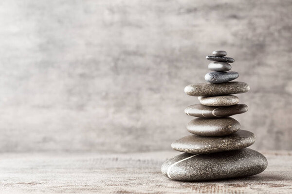 Spa stones on the grey background.