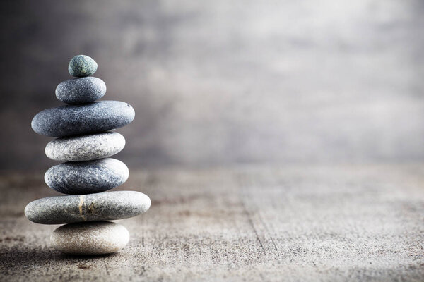 Massage stones put in the form of a pyramid.