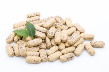 Vitamin kapsülleri, alternatif tıp homeopatik takviyesi.