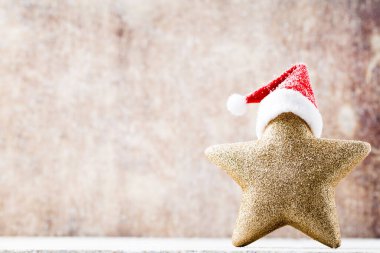 Noel Baba şapkalı bir Noel yıldızı. Vintages arkaplanı.