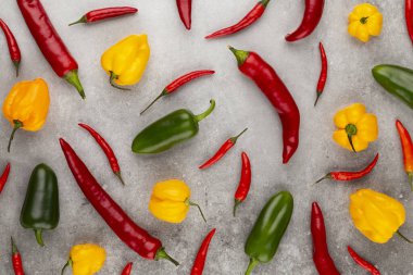 Pastel arka planı olan kırmızı biber deseni, kalıp arka plan tasarımı.