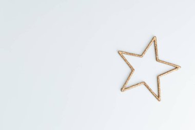 Şenlikli pastel arka plan. Noel yıldızları ve parıldayan parıltılar, pastel arka planda konfeti. Noel arkaplanı, düz uzanma.