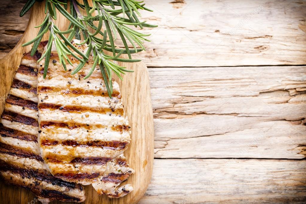 Grilled pork chops pieces. Spices and rosemary.