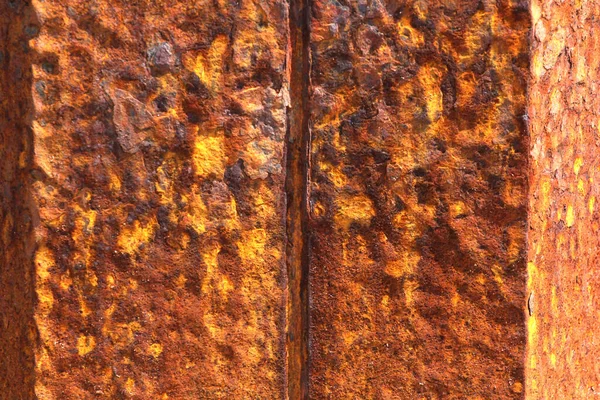 Metallic rusted plates in orange and brown