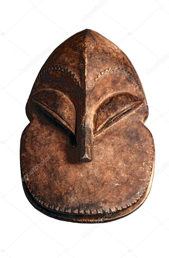An Original African old tribal mask figure, hand carved from wood. Isolated on white.