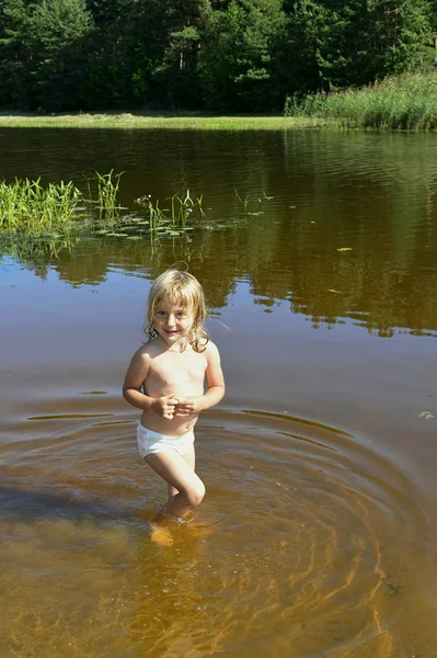 Little girl in water on sunny day — Stock Photo, Image