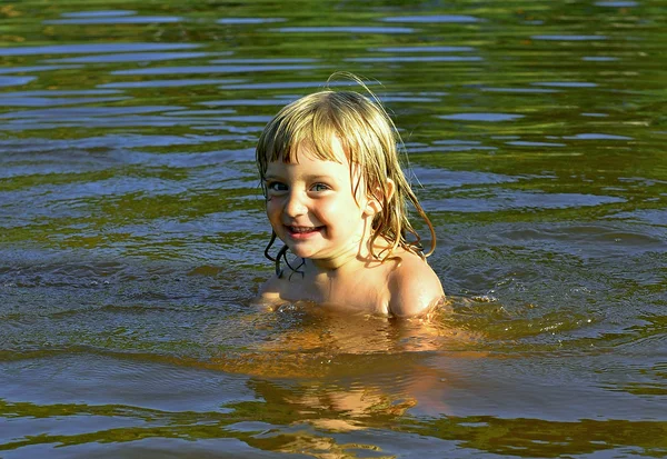 Little girl in water on sunny day — Stock Photo, Image