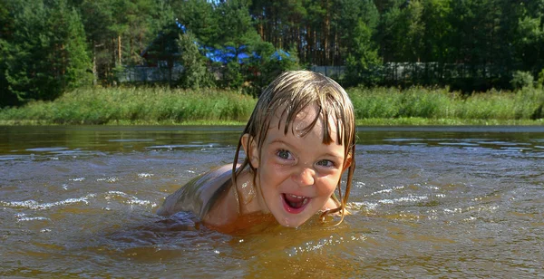 Little girl in water on sunny day — Stock Photo, Image