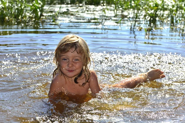 Little girl in water on sunny day — Stock Photo, Image