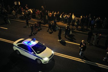 The police car patrols