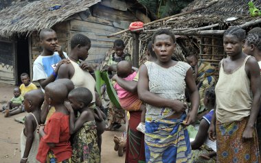 People from a tribe of Baka pygmies in village of ethnic singing. Traditional dance and music. Nov, 2, 2008 CAR