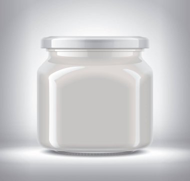 Arka planda Süt Yemeği olan Cam Kavanoz. 