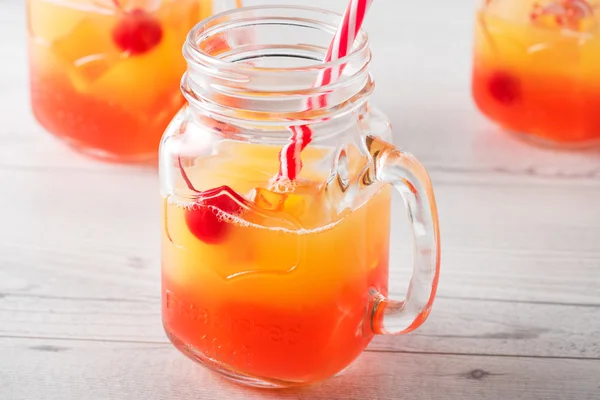 Tequila sunrise cocktails in glass jar — Stock Photo, Image