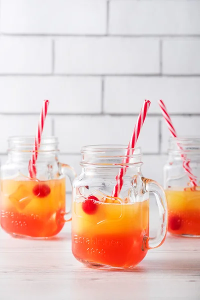 Tequila sunrise cocktails in glass jar — Stock Photo, Image