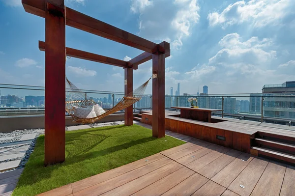 Roof terrace with hammock on a sunny day — Stock Image Roof terrace with hammock on a sunny day Stock Image