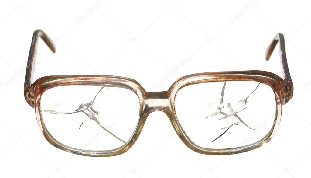 Old broken glasses isolated on white background.