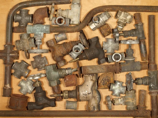 Old and rusty fittings and valves. — Stock Photo, Image