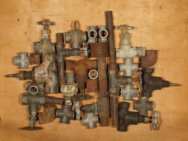 Old and rusty fittings and valves. — Stock Photo, Image