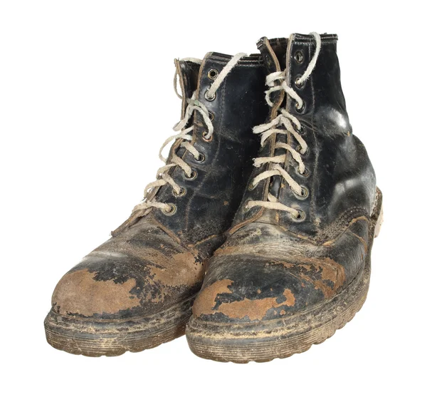 The old worn out boots with white laces isolated on white backgr ...