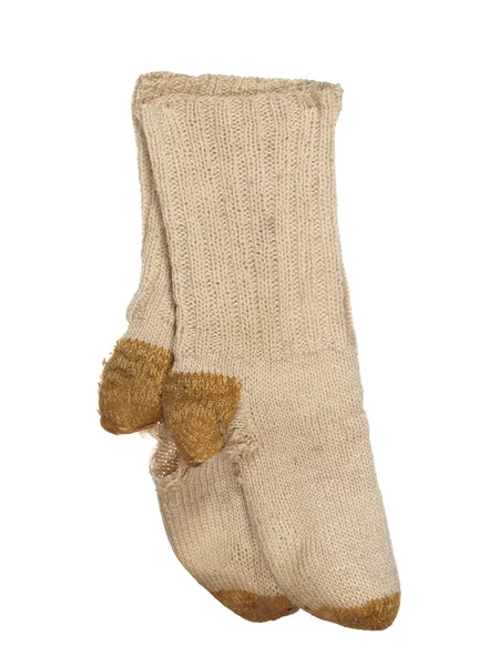 Viejos calcetines de lana andrajosos aislados sobre un fondo blanco . — Foto de Stock