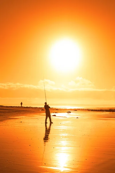 Lone fisherman fishing on the Ballybunion beach — Stock Photo, Image