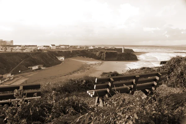 Benches on a cliff edge  with views of Ballybunion in sepia — Stock Photo, Image