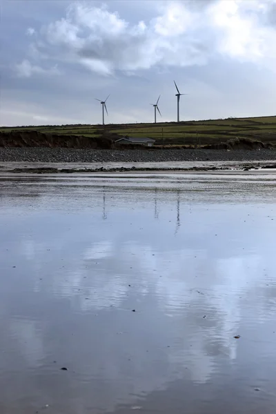 Windmills reflected on Beal beach — Stock Photo, Image