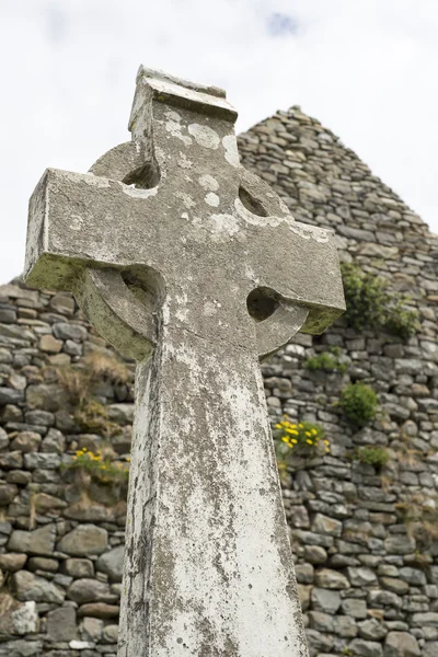 Vecchia croce celtica pietra testa Foto Stock