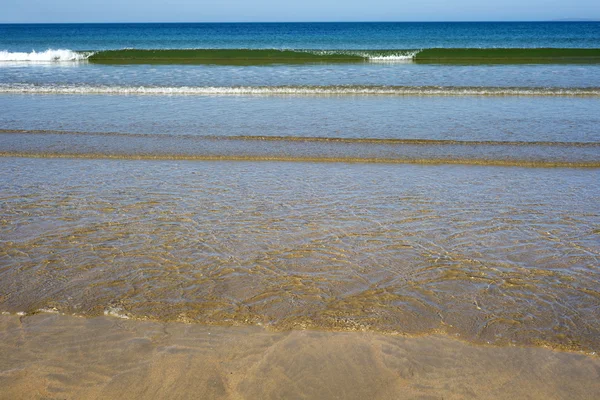 Gentle soft waves lashing onto ballybunion sand — Stock Photo, Image