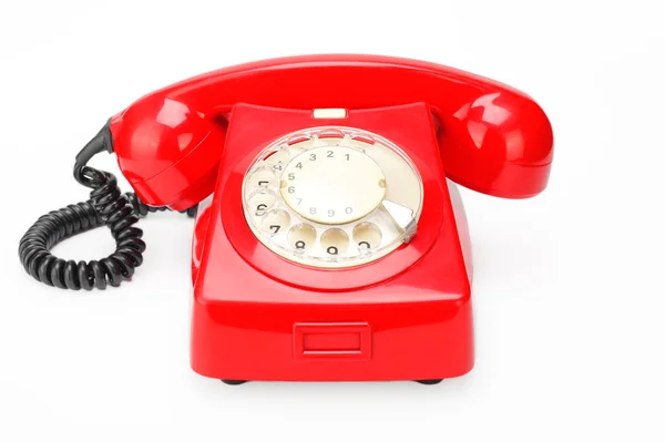 Telefone vintage vermelho em um fundo branco — Fotografia de Stock