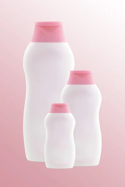 Tres botellas vacías de color rosa claro. Aislado — Foto de Stock