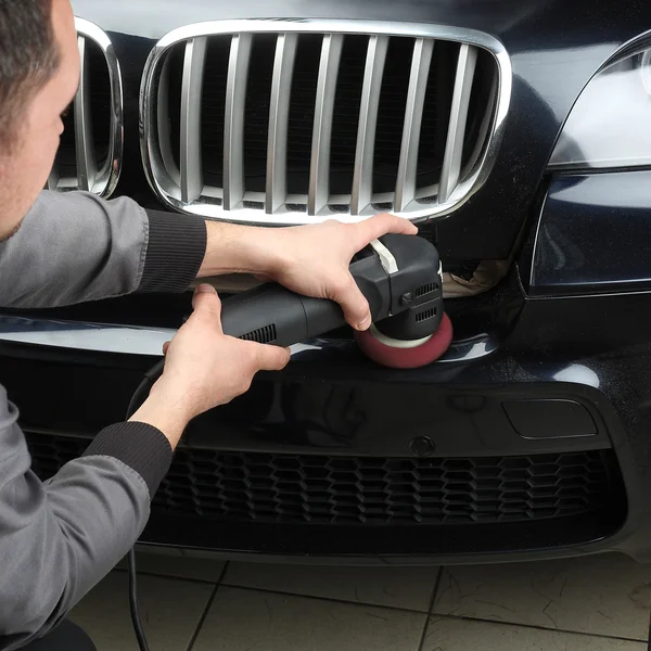 Car service. Polishing of the bumper car — Stock Photo, Image