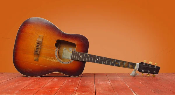 Musical Instrument Front View Broken Classic Acoustic Guitar Orange Wall — Stock Photo, Image