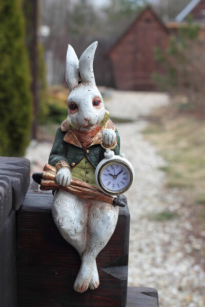 Clock. Hare with umbrella