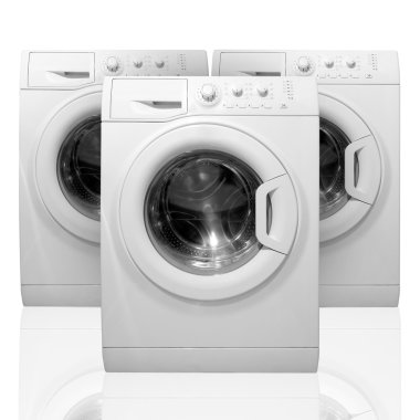 Three washing machines. Isolated