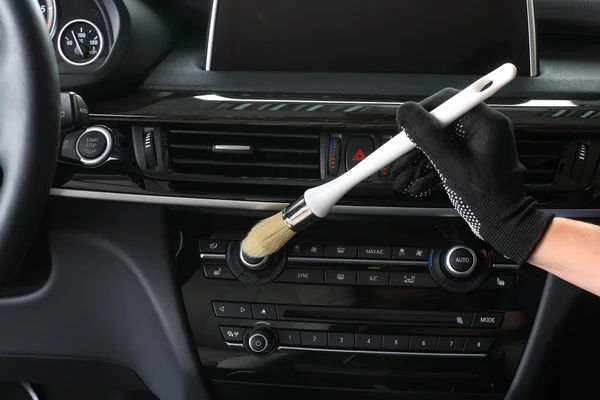 Car service. Cleaning of  interior by a brush — Stock Photo, Image