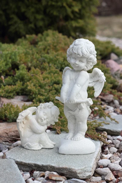 Two Figure of Cupid on a stones — Stock Photo, Image