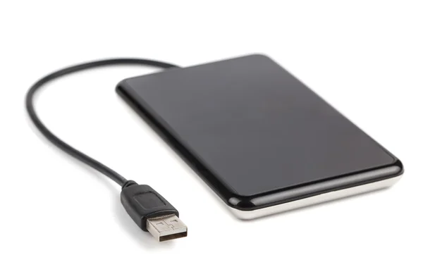 Black external hard disk with cable Royalty Free Stock Images
