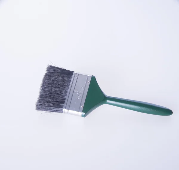 Paint brush or green paint brush on a background. — Stock Photo, Image